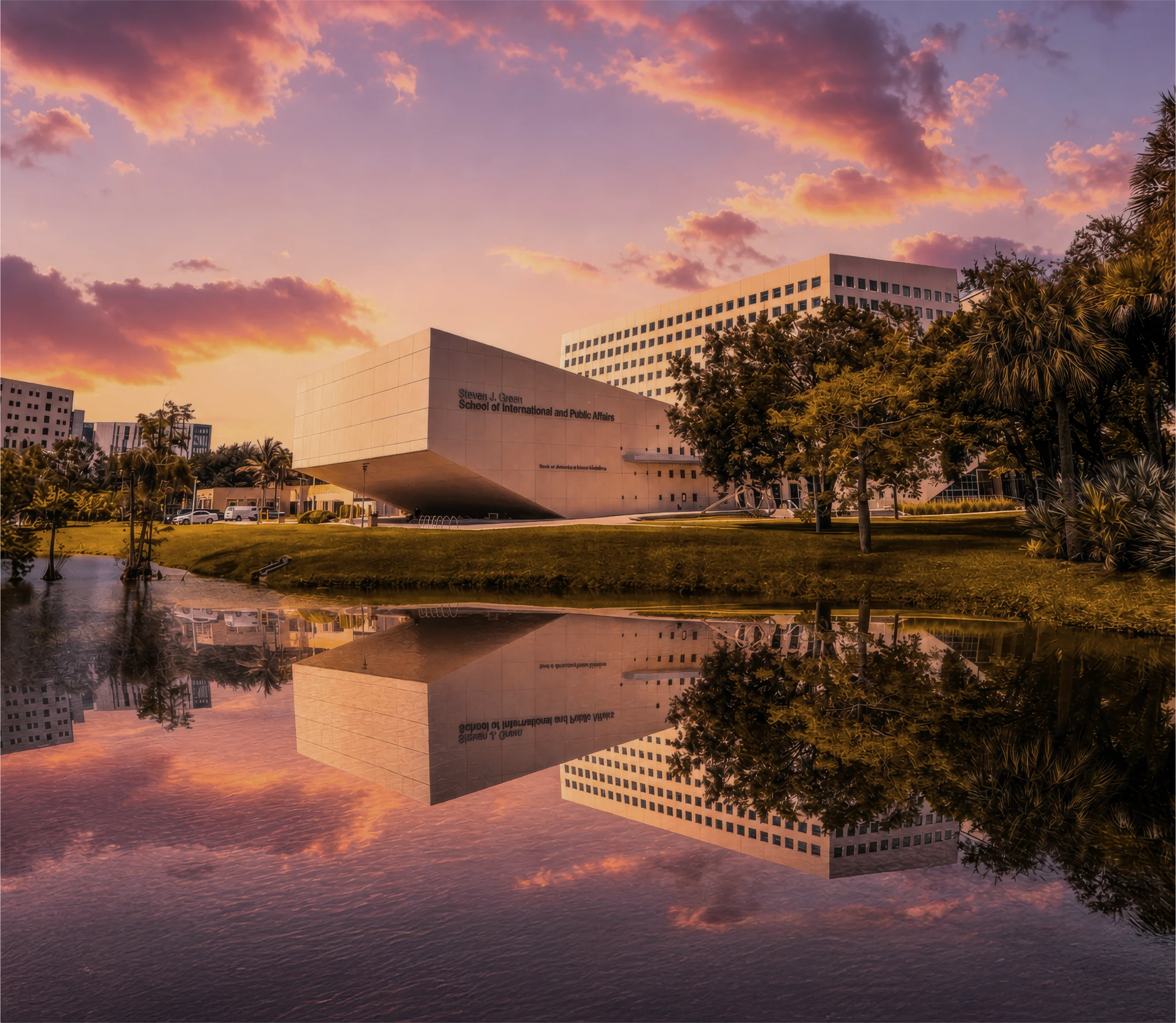 Florida International University building reflected in water during sunset in Sweetwater, Florida.